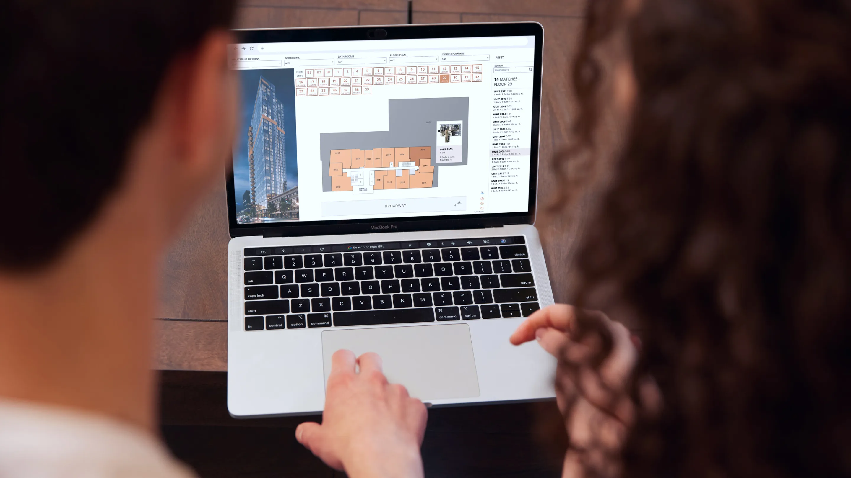 A man and woman using SightMap on a laptop